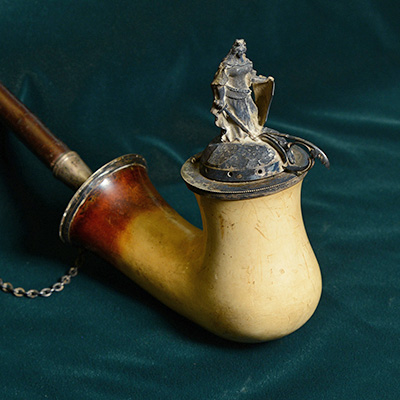 One of Pike’s favorite pipes is 22 inches long with a silver statuette of Germania.