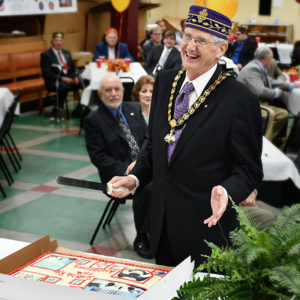 Ill. William Brunk cutting cake during the Valley of Greensboro centennial celebration on October 11, 2017.