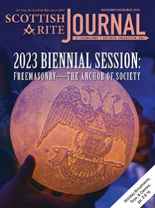 2023 Biennial Session: Freemasonry—The Anchor of Society. Close-up of an illuminated sphere with 32° Scottish Rite Double-headed Eagle embossed on it