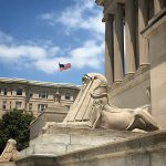 Photo of the exterior of the House of the Temple showing a US flag and the sphinxes