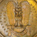 Detail of a bronze medallion featuring a 33rd Degree Scottish Rite Double-headed Eagle