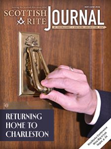 Photograph of hand using a door knocker. Title text: "Returning Home to Charleston." Caption: Now adorning the entrance to the House of the Temple’s Executive Chamber, this well-worn brass knocker originally hung on the door to the Supreme Council chamber in Charleston, S.C., the birthplace of the Supreme Council, 33°, SJ, USA. On May 31, 2026, the Supreme Council, 33°, will live-stream a special session in Charleston to commemorate the 225th anniversary of the establishment of the Mother Supreme Council, 33°.